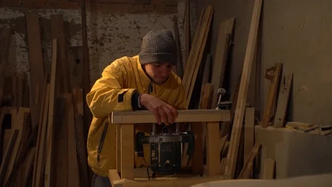 Young guy working in his workshop Stock Footage 125859120