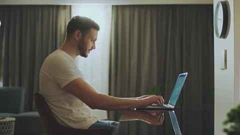Young guy working remotely Stock Footage 234347590