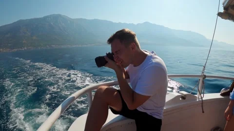 Young guy on a yacht Stock Footage 248125404