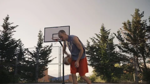 Young guys are training to play on the playground in basketball score goals Stock Footage 110617964