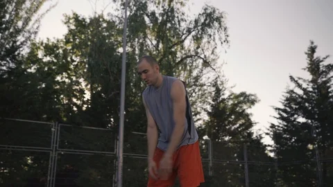 Young guys are training to play on the playground in basketball score goals Stock Footage 110617981