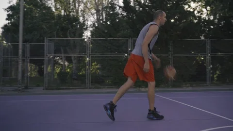 Young guys are training to play on the playground in basketball score goals Stock Footage 110617995