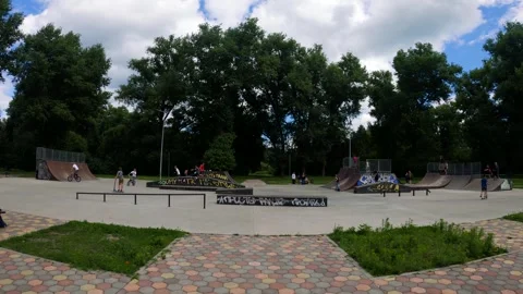 Young guys do tricks on bicycles and scooters at a skatepark in Sumy, Ukraine Stock Footage 276904158
