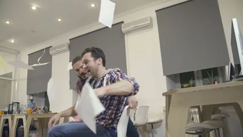 Young guys have fun in the office during a break Stock Footage 72574907