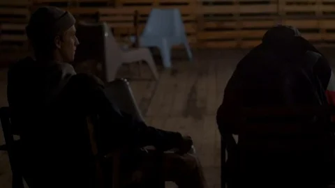 Young guys sit on stools and smoke Stock Footage 81783116