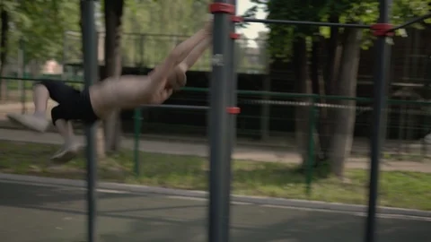 Young gymnast makes monkey bar exercises Video stock 92312450