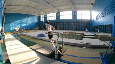 Young gymnast on the squared beams Stock Footage 36784819