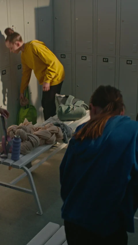 Young Gymnasts Changing Clothes and Talking in Studio Dressing Room Stock Footage 339647414