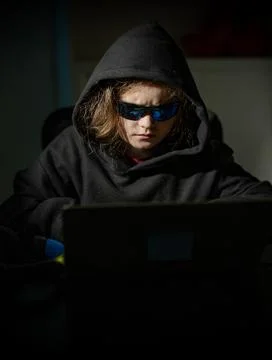 Young hacker with anonymous digital identity. Kid hacker with digital privacy Foto stock