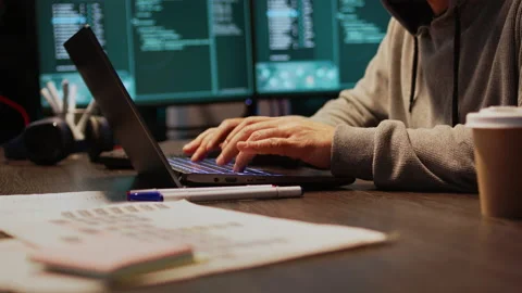 Young hacker breaking into database server on computer Video stock 221873601