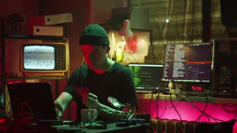 Young hacker breaking password of credit bank card. Man programmer infecting Stock Footage 160267889