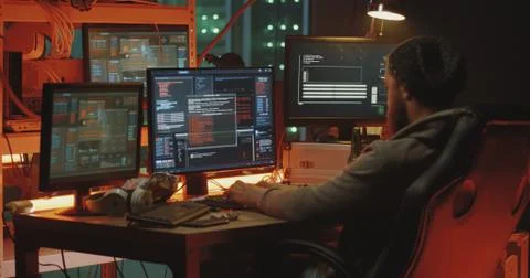 Young hacker coding on his computer 스톡 사진