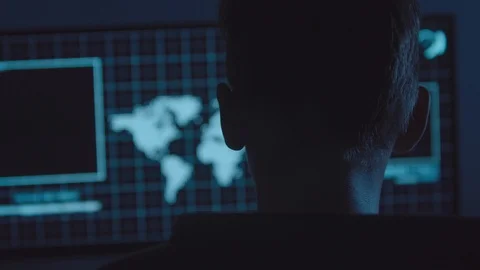 Young Hacker doing Attack on Data Servers and bank's account to still the secret Stock Footage 94195654
