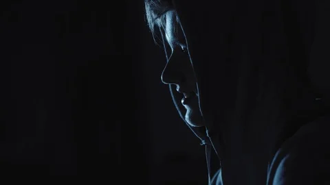 Young Hacker doing Attack on Data Servers and bank's account to still the secret Stock Footage 95751922