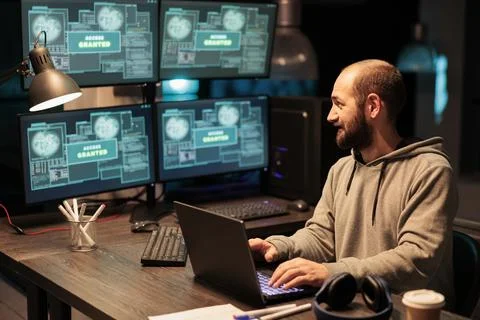 Young hacker stealing programming data from server, Stock Photos