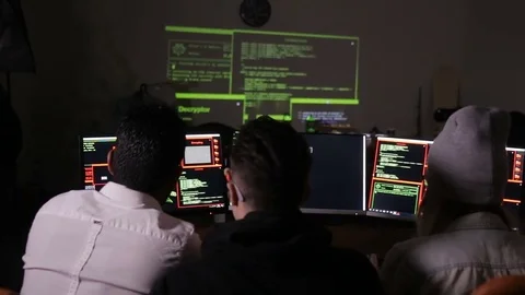 Young hacker team working on a computer. Cybercrime, cyber attack concept Stock Footage 71270482