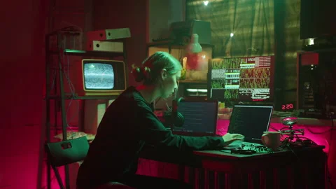 Young hacker typing on keyboard at night, breaking password, using laptop and Stock Footage 159418299