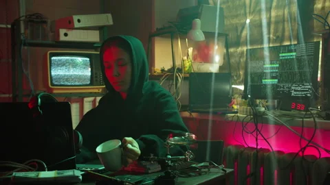 Young hacker typing on keyboard at night, breaking password, using laptop and Stock Footage 159506924