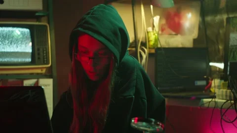 Young hacker typing on keyboard at night, breaking password, using laptop and Stock Footage 159798804