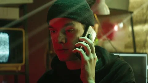 Young hacker typing on keyboard at night, breaking password, using laptop and Stock Footage 161177855