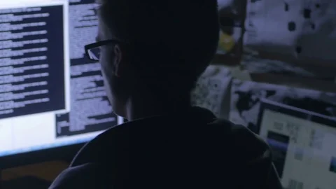 Young hacker working on the large computer screen Stock-Footage 72476807