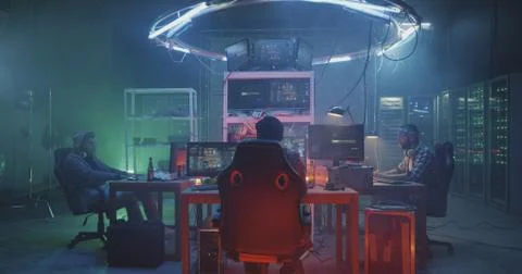 Young hackers coding on their computers Stock Photos