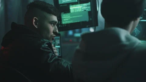 Young hackers writing malware together Stock Footage 170186883