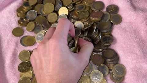 Young hand grabs coins Stock Footage 224882463