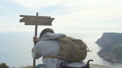 Young Handicapped Man On The Top Of Mountain Stock Footage 64545708