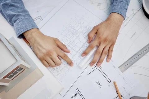 Young handsome architect engineer working on design plan 스톡 사진