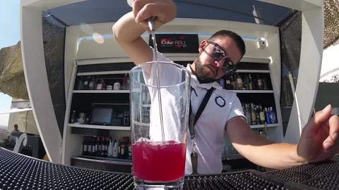 Young Handsome Barman Preparing Alcoholic Cocktail, Pouring Vodka, Mixing Ice Stock-Footage 86853848