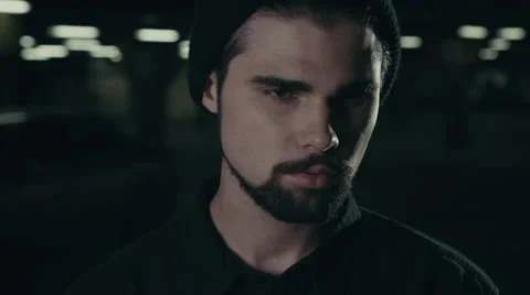 Young handsome bearded man smoking cigarette Stockbeeldmateriaal 56262929