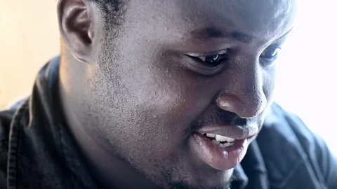 Young handsome black man expression working looking reading playing Stock Footage 105976569