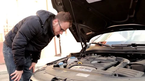 Young handsome boy in black jacket and glasses, standing behind his car 8 Stock Footage 49338359