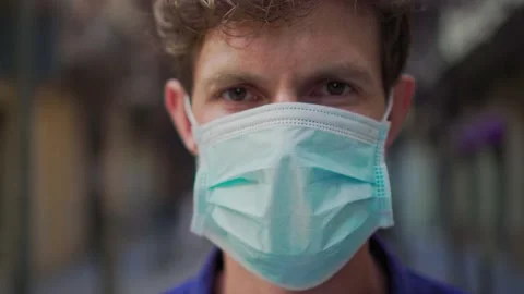 Young handsome british fashion man with medical face pollution mask to protect Stock Footage