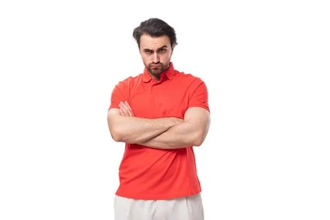 Young handsome brunette man with a beard is dressed in a standard red t-shirt on Stockfoto's
