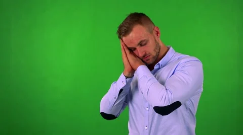Young handsome business man wakes up and he is suprised - green screen - studio Stock Footage