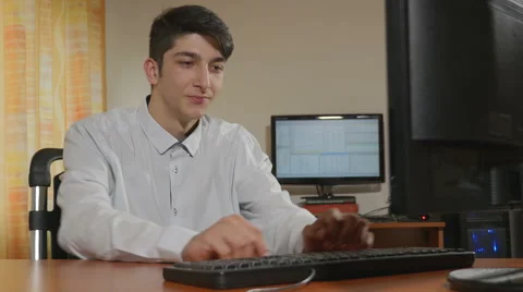 Young handsome businessman programmer dancing while working Stock Footage 58958477