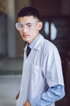 Young handsome chemist working in the lab Stock Photos