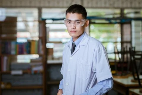 Young handsome chemist working in the lab Stock Photos