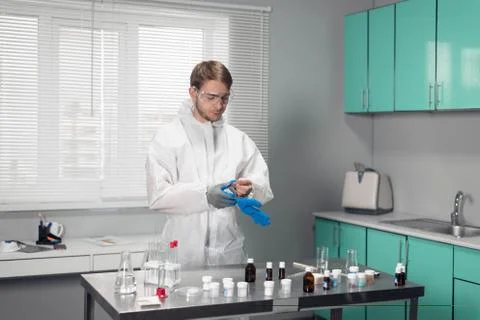 Young handsome chemist working in a lab Stock Photos