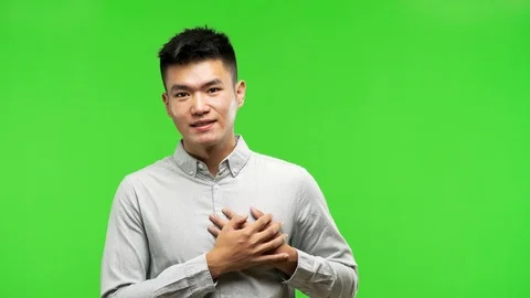 Young handsome chinese man doing a romantic gesture Stock Footage 97870465