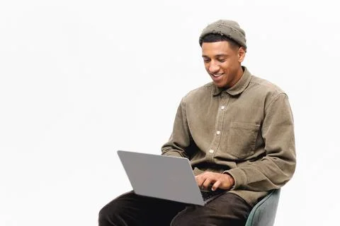 Young handsome freelancer guy working with laptop Stock Photos