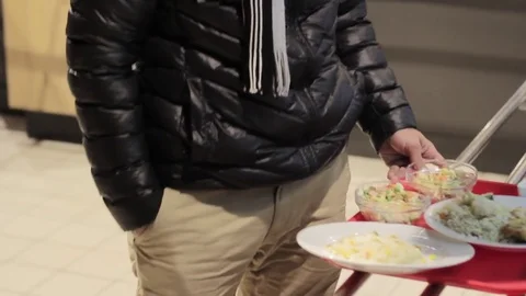 Young handsome guy from Dubai is standing in line to pay money for food 스톡 동영상 82907521