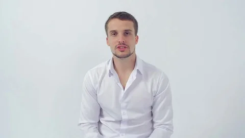 Young handsome guy at  job interview makes face palm after a stupid question Stock Footage 83597308