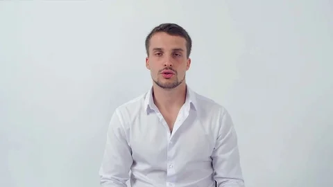 Young handsome guy at a job interview tells a story and smiles after questions Stock Footage 83597329