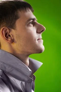 Young handsome guy sideview headshot portrait of young handsome brunet guy... Stock Photos
