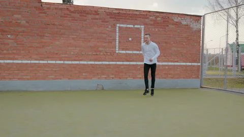 Young handsome guy, a street dancer performing a leap of Grand jete on the Stock Footage 108722829
