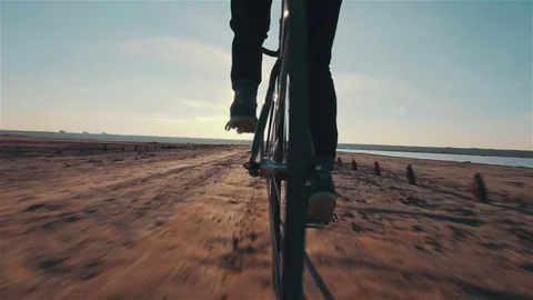 Young handsome hipster man riding fixed gear bicycle during sunset, outdoor Stock Footage