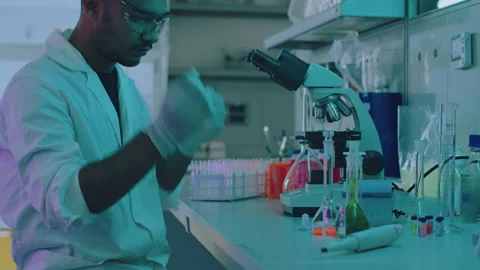 Young Handsome Lab Assistant Wearing Protection Goggles Stock Footage 164996048